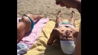 HD Cumshot on two topless sunbathers